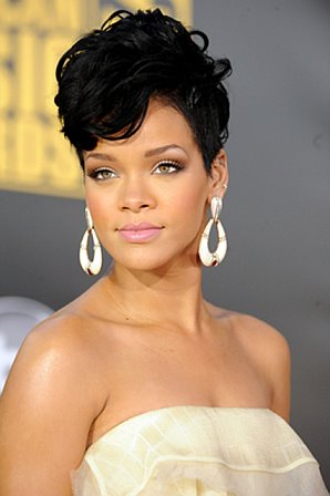 rihanna red hairstyles 2010. Red is sooo not her thing.