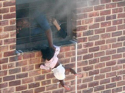Mothers Love!!! See What A Woman Did To Save Her Child From A Fire Outbreak