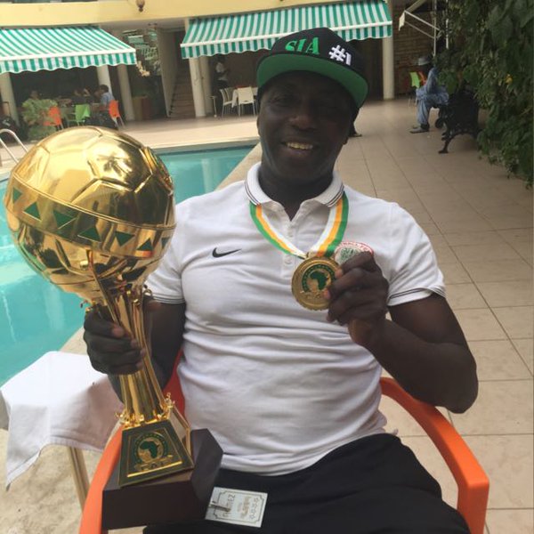 The U-23 Trophy And His Medal Samson Siasia Flaunts 