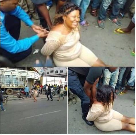 Woman Goes "Mad" In Public, Undresses Herself On A Busy Street. 