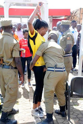 PHOTOS: Ugandan Police Search Women To Their Pants Before 