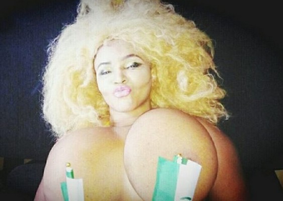 Cossy Orjiakor Puts Her Boobs On Display With Only A Nigerian Flag Covering...