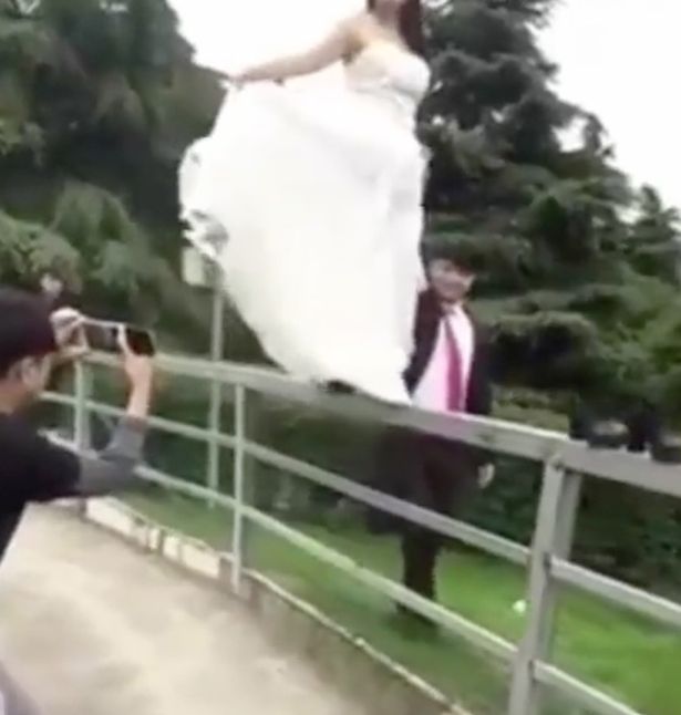 Chinese Bride Falls From A Metal Fence While Taking Wedding Photoshoot ...