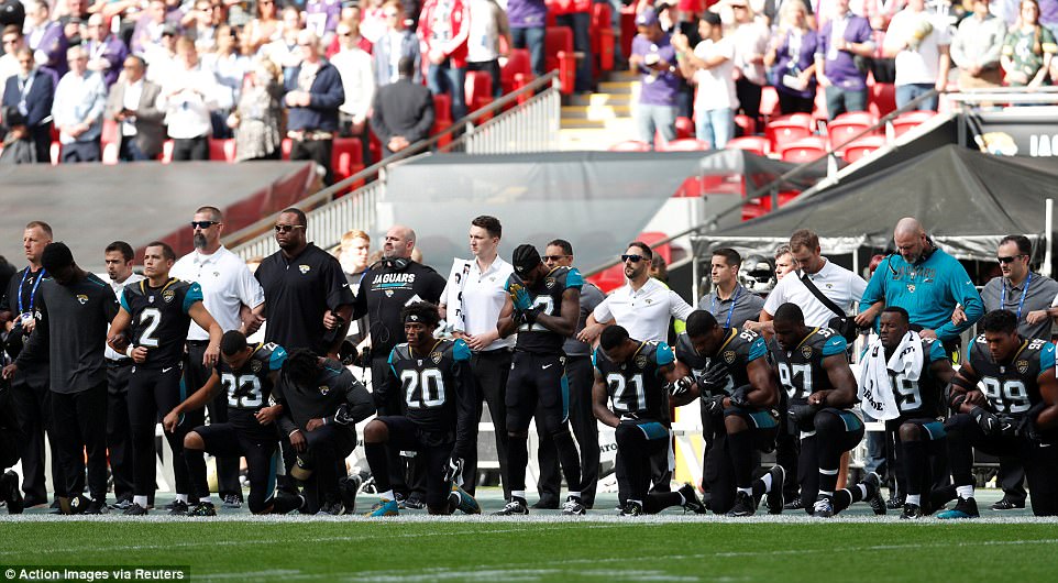 American Football Stars Drop To Their Knees During National Anthem To