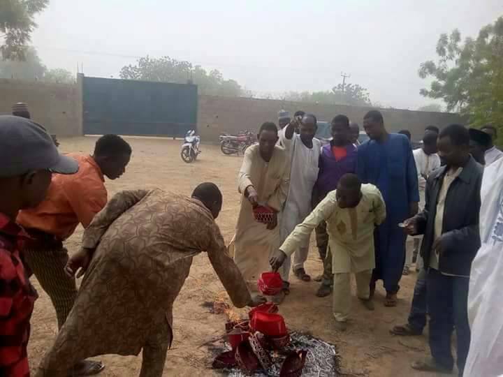 Image result for 10,000 Kwankwaso Supporters Dump PDP for APC, Burn Redcaps in Kano