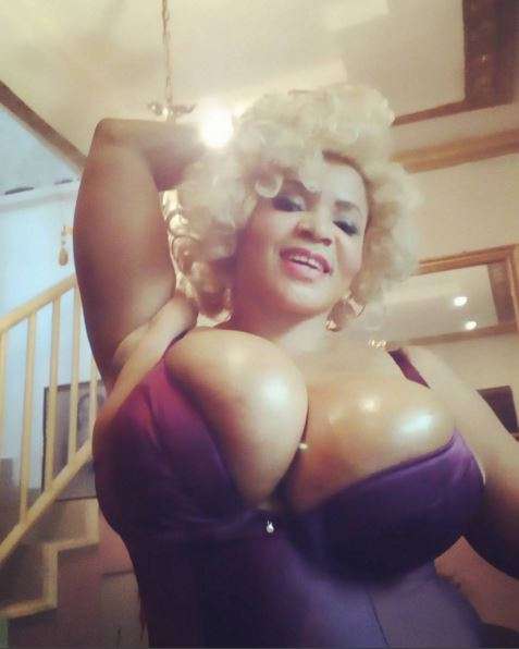Cossy Orjiakor's gigantic boobs nearly spill out of her bikini as