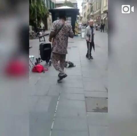 Photos: Meet Nigerian Man Who Sings & Beg On The Streets Of Italy For A Living 2